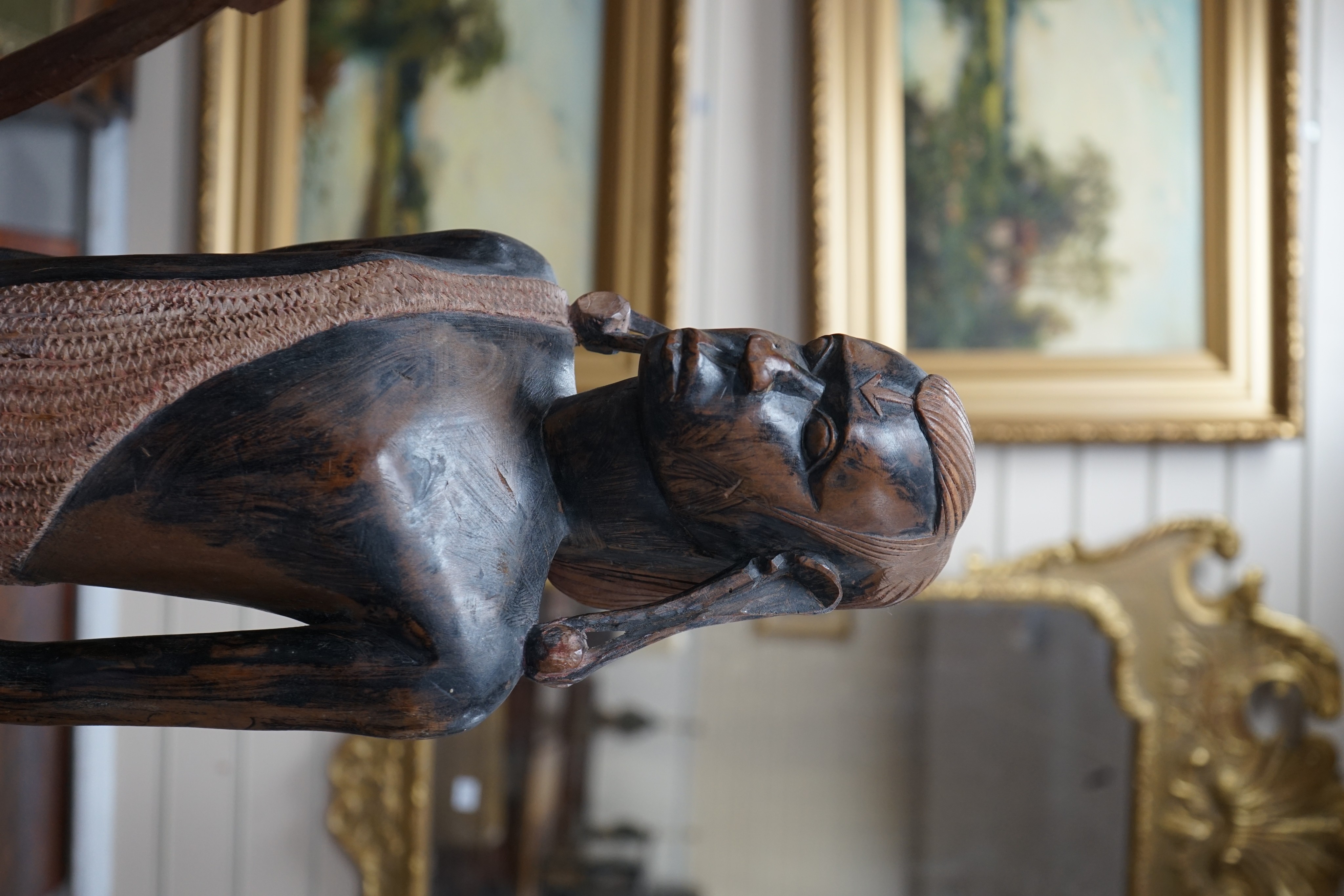 A tall West African carved figure of a warrior, 100cm